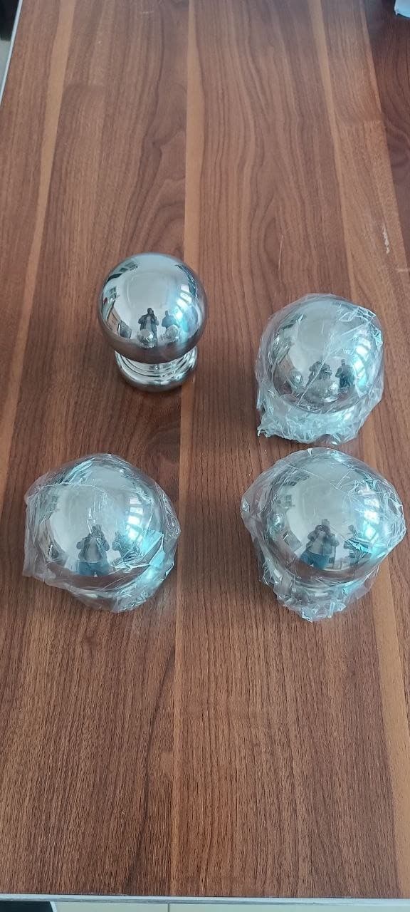 Polished stainless ball caps and finials