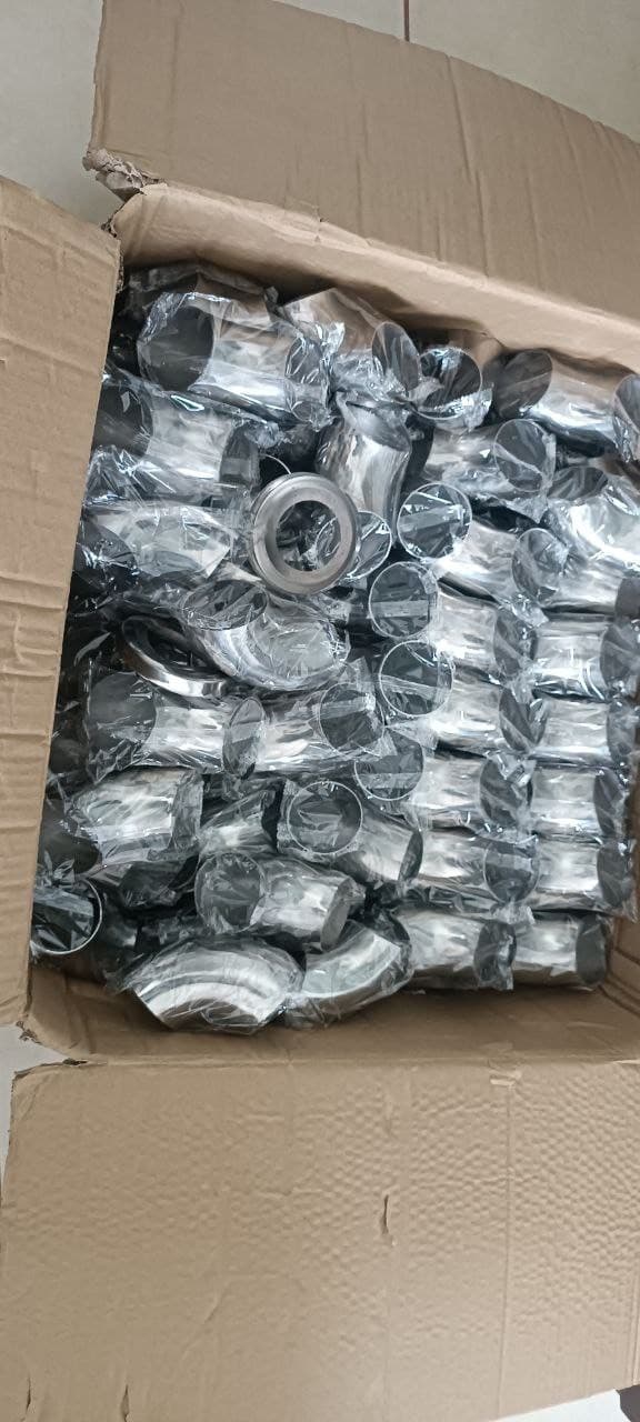 Box of polished stainless steel elbow fittings