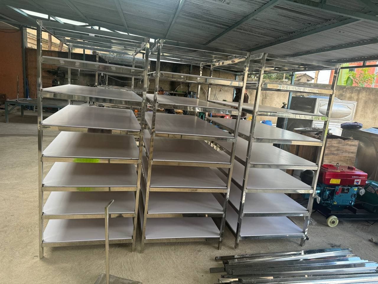 Stainless steel shelving units in the fabrication workshop
