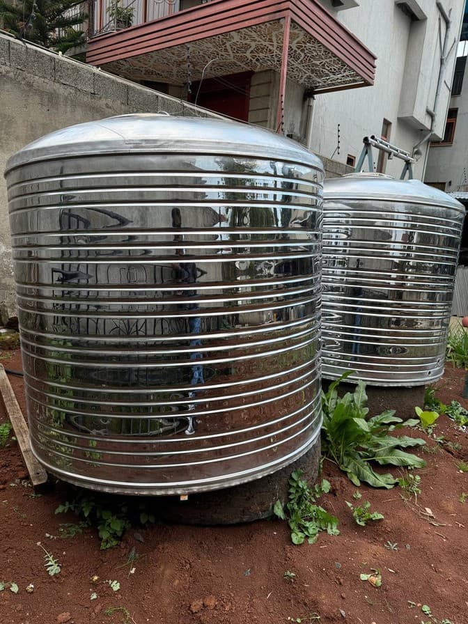 Two round stainless tanks installed outdoors